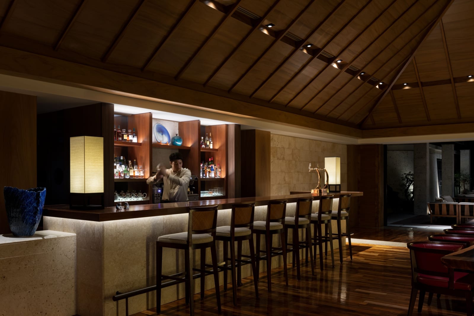 Bar counter with bottle display behind