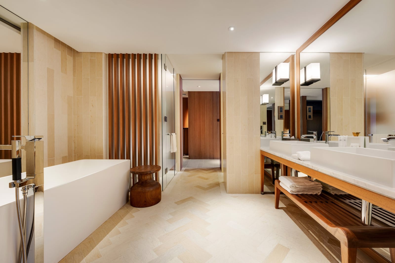 A guest bathroom with a bathtub and vanity