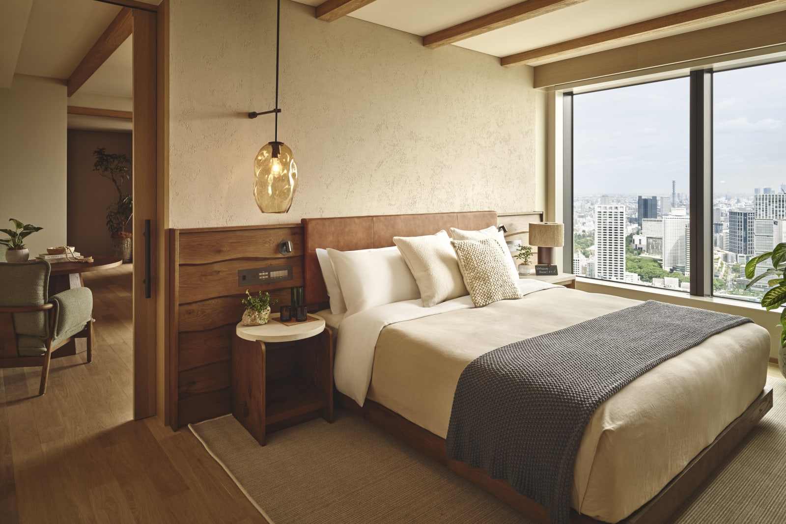 Bedroom of the Panoramic Garden Junior Suite with a panoramic window