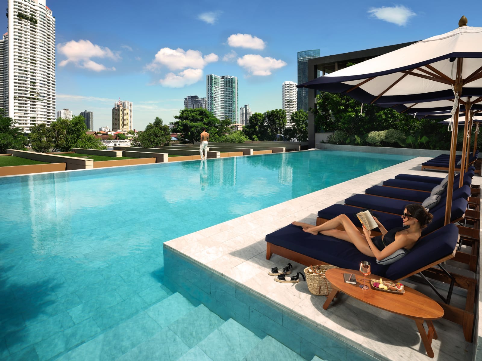 The infinity pool at Capella Bangkok facing the Chao Phraya River
