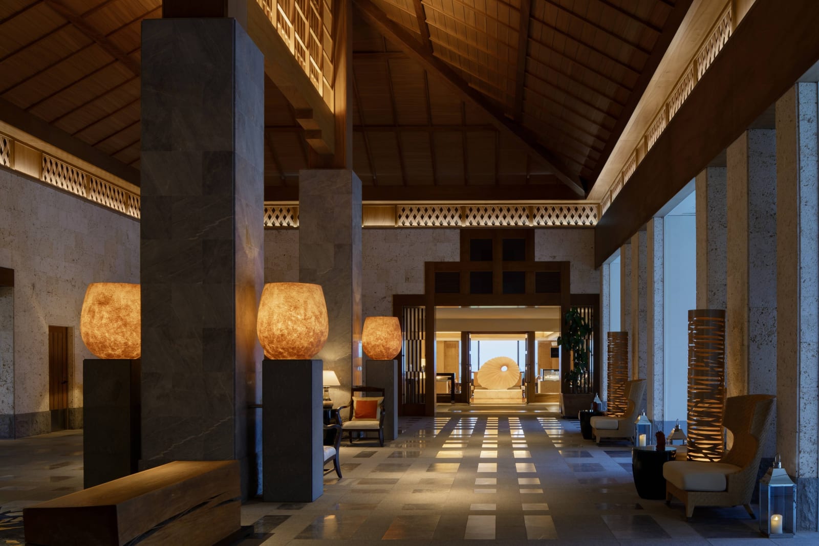 Lobby of The Ritz-Carlton, Okinawa, with a high ceiling and columns