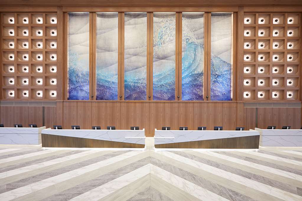 Large millwork wall and colorful artwork in a public space