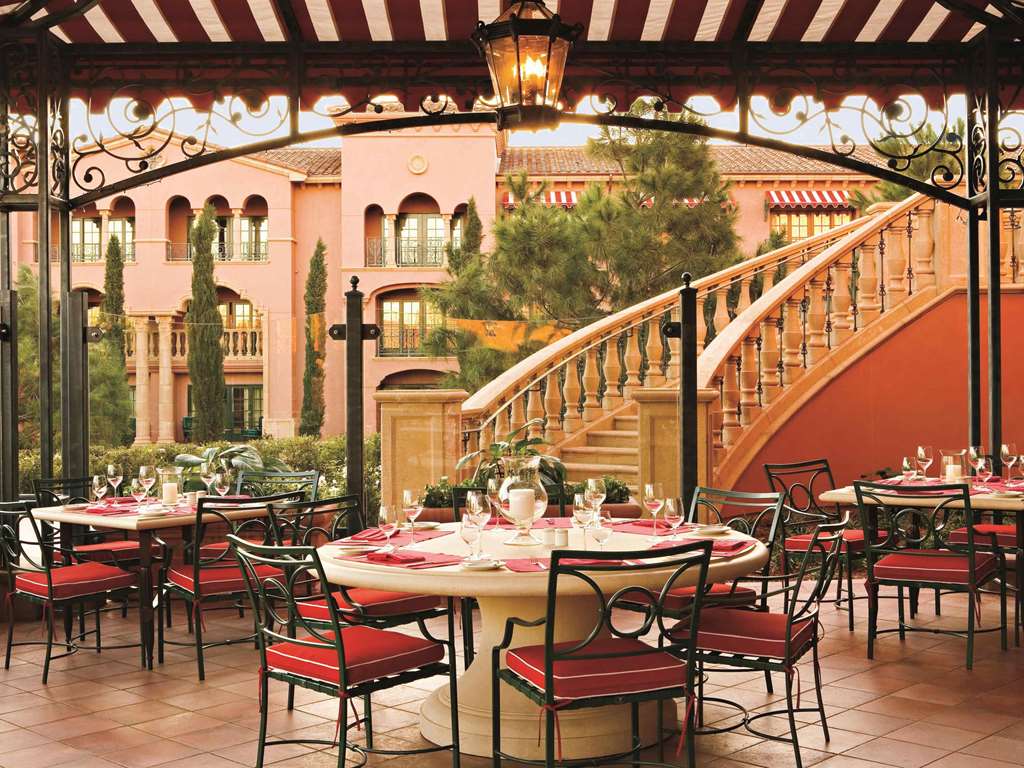 Restaurant terrace with a curved staircase leading up