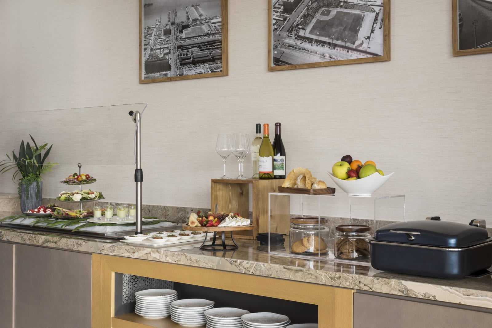 Club lounge buffet counter with pastries, fruit and drinks
