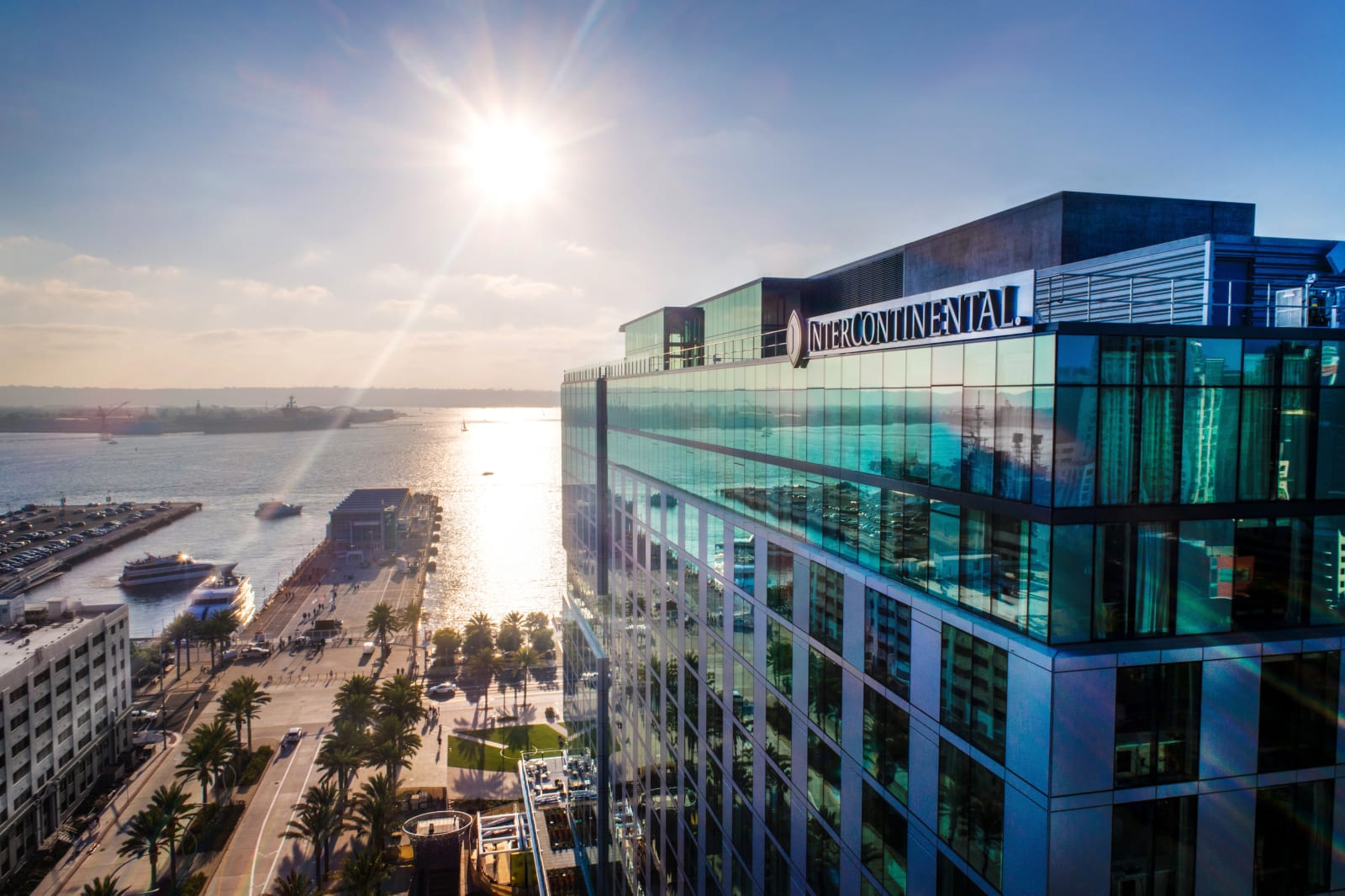 Aerial view of the InterContinental San Diego glass tower and San Diego Bay
